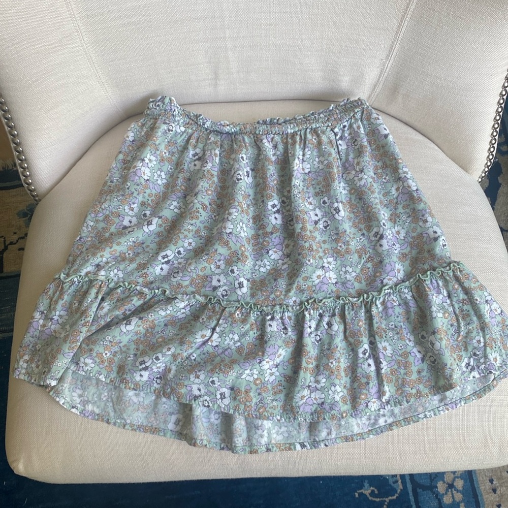 a green floral skirt